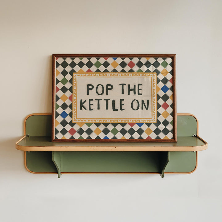Jenna Crush Pop the Kettle On art print on kitchen shelf